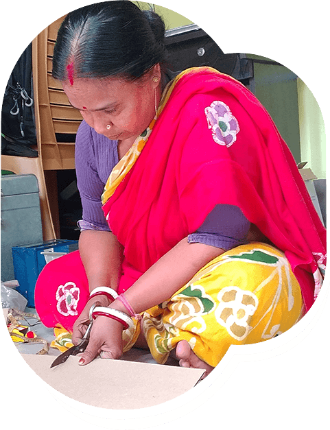 Women in group making sholapith crafts