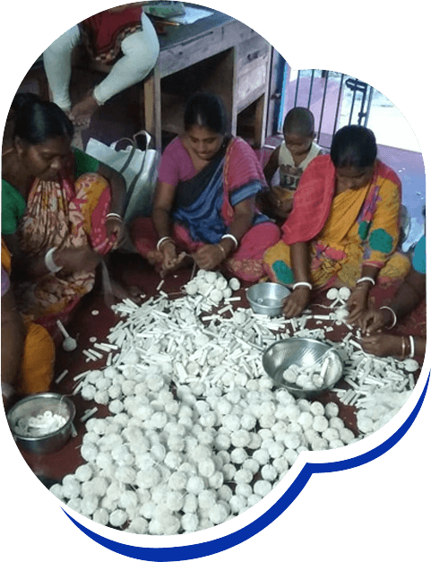 Women in group making sholapith crafts
